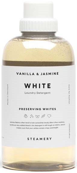 Eine transparente Flasche mit weißem Waschmittel, gekennzeichnet mit 'White', Vanille und Jasmin Duft.
