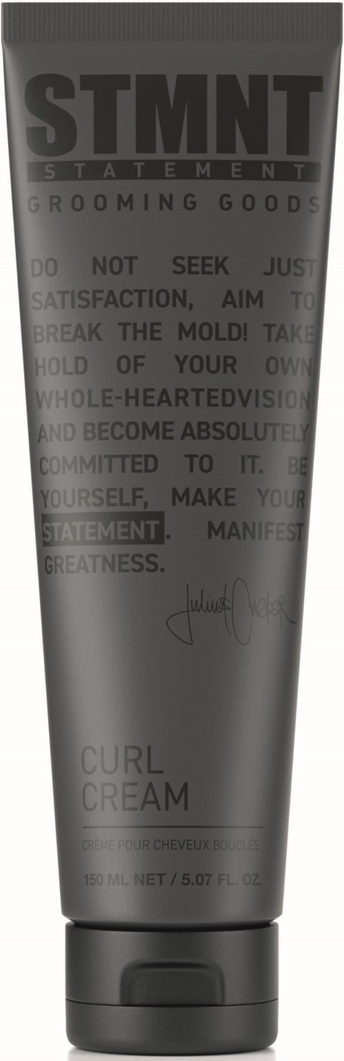 A gray tube labeled STMNT Grooming Goods, containing curl cream, with a black cap at the bottom.