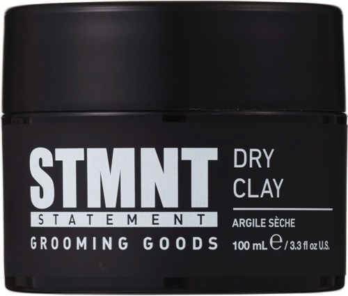 A black container of grooming product labeled 'STMT Dry Clay' with 100 mL capacity.
