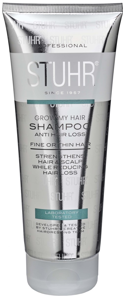 A silver and white tube of shampoo labeled STUHR, for hair growth and anti-hair loss, with a black and white logo.