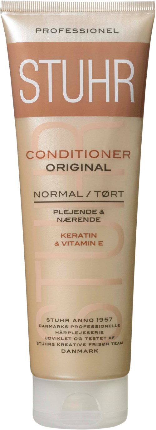 A beige tube of hair conditioner labeled 'STUHR' for normal to dry hair, with mention of keratin and vitamin E.