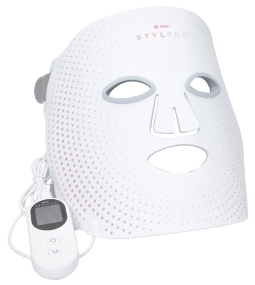 Eine weiße Gesichtsmaske, verbunden mit einem Fernbediengerät für Hautpflegebehandlungen.