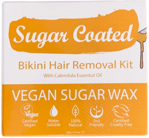 A box describes a vegan sugar wax kit with essential oil, highlighting eco-friendliness and cruelty-free features.