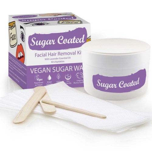 A vegan sugar wax kit with lavender essential oil, including a jar, spatula, and applying sheet.