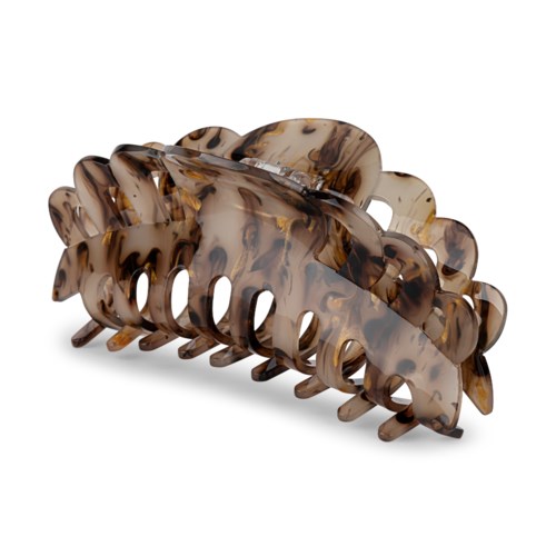 En stor hårspenne i tortoiseshell-mønster med oval form og mange tenner for å holde håret.