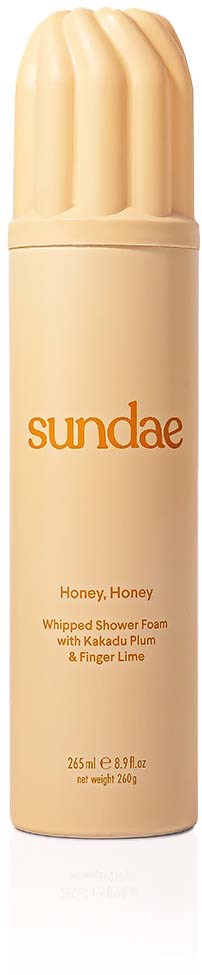 Eine Flasche Duschschaum mit Honiggeschmack, mit 'sundae' und 'Honey, Honey' beschriftet, beige Kappe und Körper.