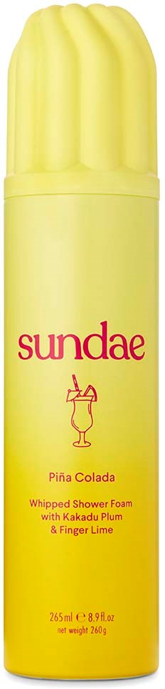 Gelbe Flasche mit pinkem Text, gekennzeichnet Sundae Pina Colada Duschschaum mit Fruchtbestandteilen, 265 ml.