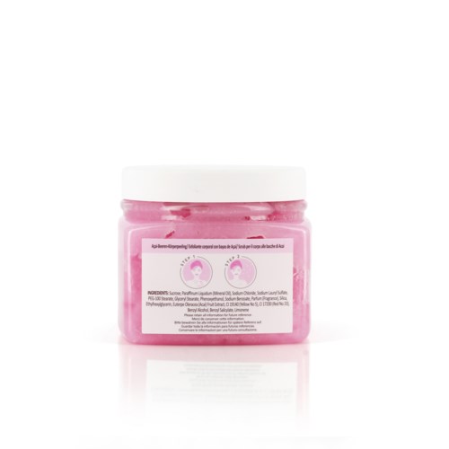 Verpakking met roze crème en witte dop, label toont twee kleine gezichtspictogrammen, ingrediëntenlijst.
