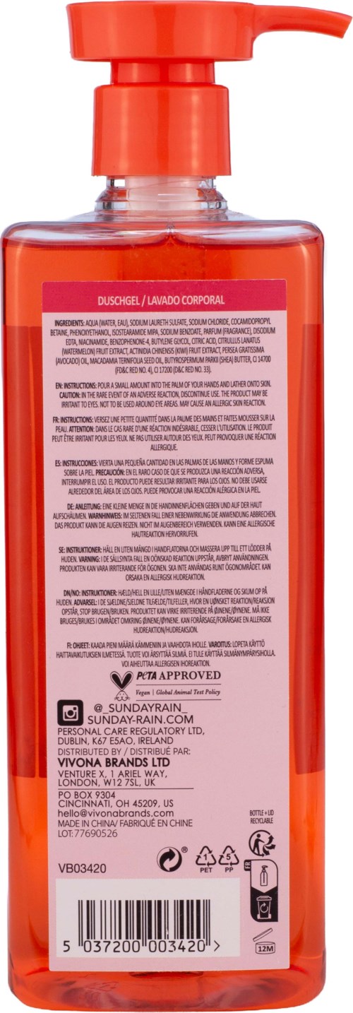 En lång orange flytande tvåldispenser med pump och text på etiketten.