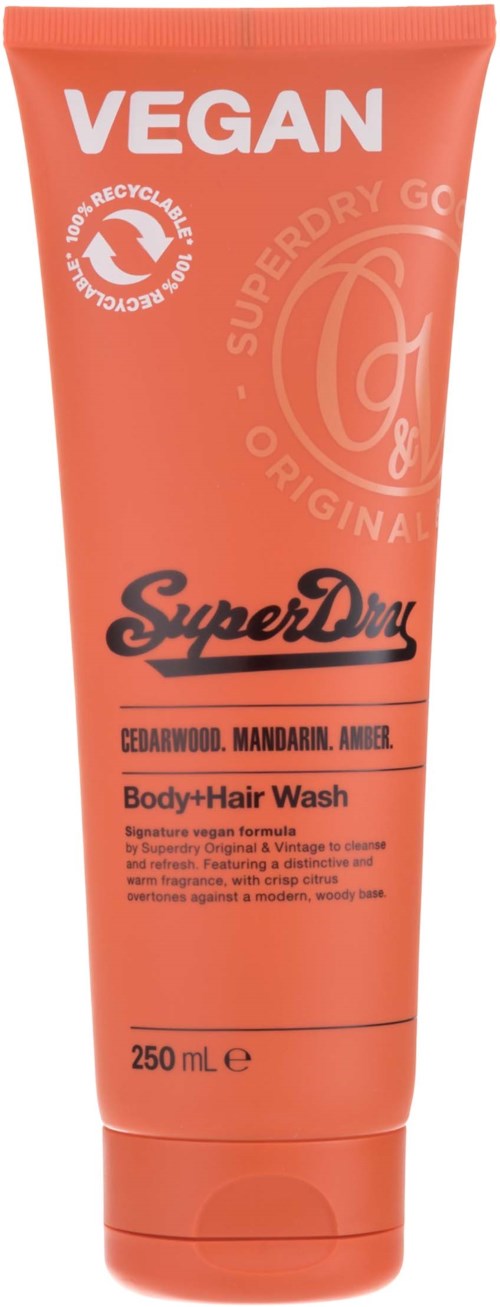 Vegan lichaams- en haarwas in een koraalkleurige tube, met 'SuperDry'-merk en 250 ml.
