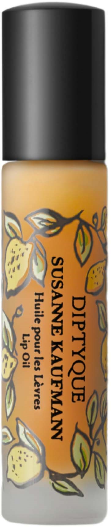 Lip gloss tube with lemon and yellow flower design, labeled Diptyque, Sunjay & Karem, with a black cap.