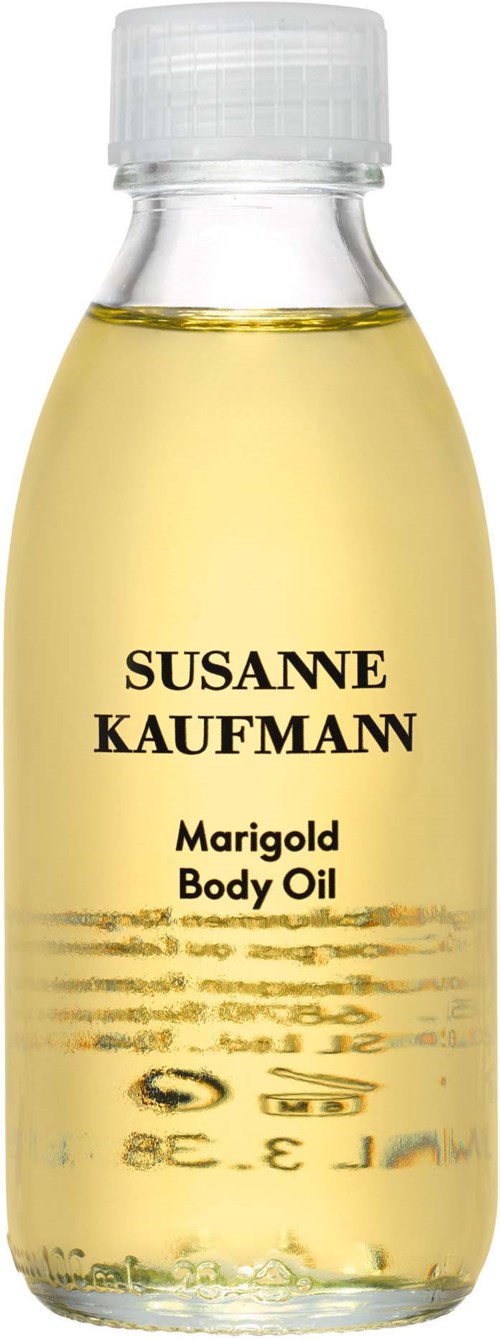 A clear plastic bottle with yellow oil inside, labeled "Susanne Kaufmann Marigold Body Oil," with a white cap.