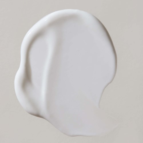 A white, smooth, oval-shaped earlobe with detailed curves and natural look.