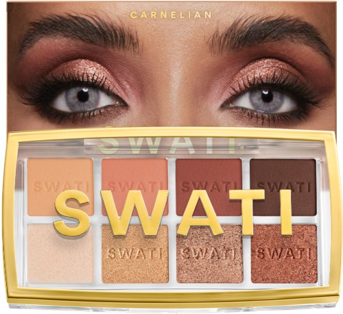 Ogen met glitter oogmake-up en een Swati oogschaduwpalet eronder.