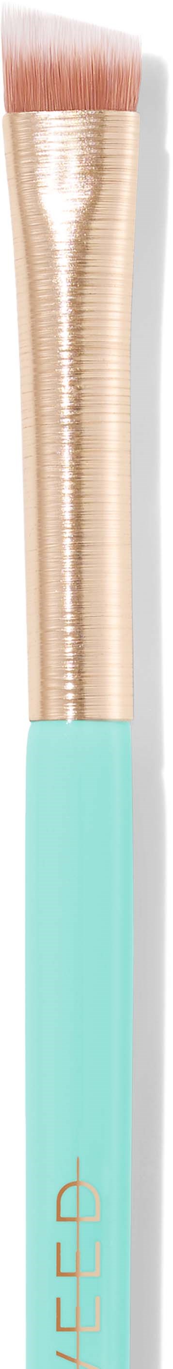 A makeup brush with a gold handle and a light blue grip, with soft pink bristles.