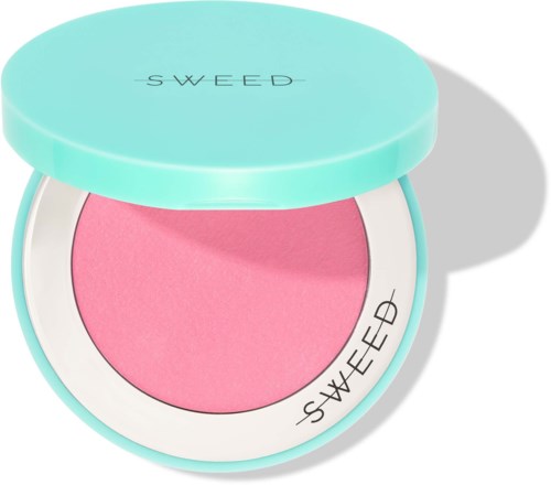 A pink blush in a round turquoise compact with a lid showing the brand name SWEEP.