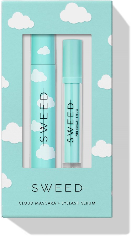 A light blue box with clouds design contains a cloud mascara and eyelash serum. The packaging is bright and soft.