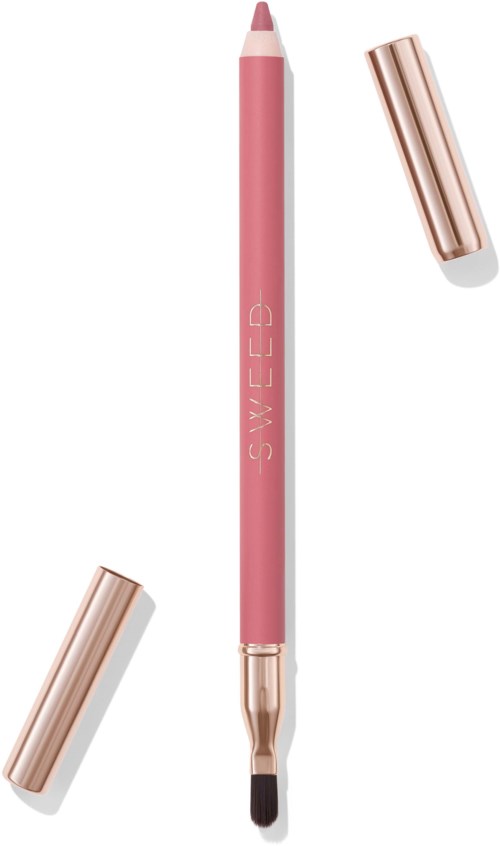 A pink makeup brush with a rose gold cap removed, showing the brush tip, on a white background.