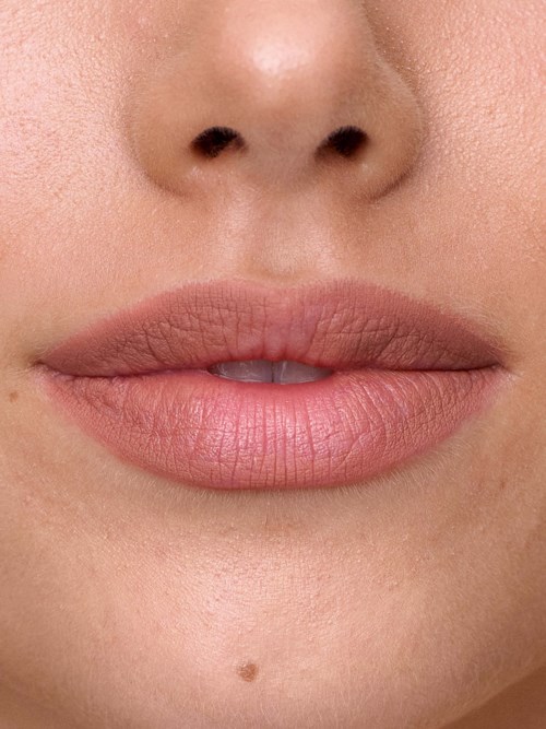 Close-up of lips and nose on a person's face.