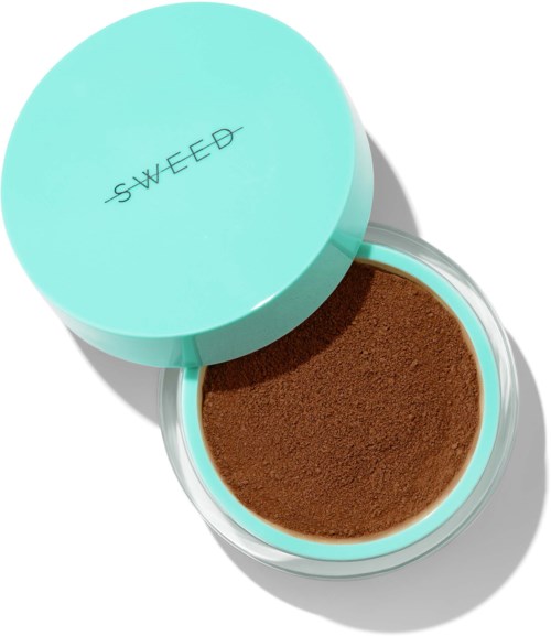 The image shows a round, open container with brown powder inside and a light blue lid with the word "SWEED".