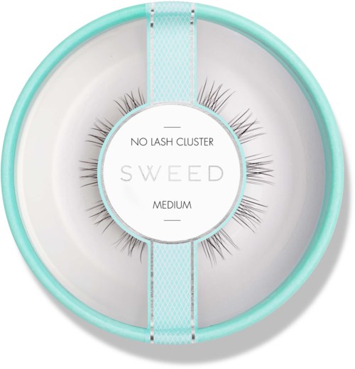 A round teal container with false eyelashes labeled as 'No Lash Cluster' and 'Medium'.