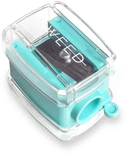 A small colored ink pad with a transparent lid and a black ink pad inside, used for stamping.