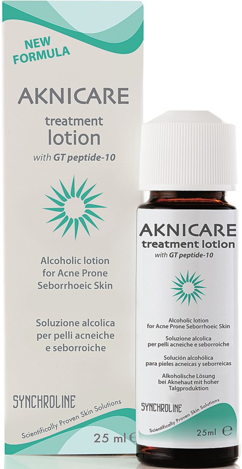 A small brown bottle of acne treatment lotion with white cap, beside its white and teal box, labeled for skin use.