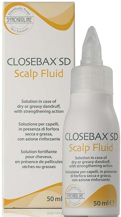 Valkoinen pullo, jossa on piikkiläppä, vieressä laatikko, jossa lukee 'CloseBAX SD Scalp Fluid' hilseen hoitoon.
