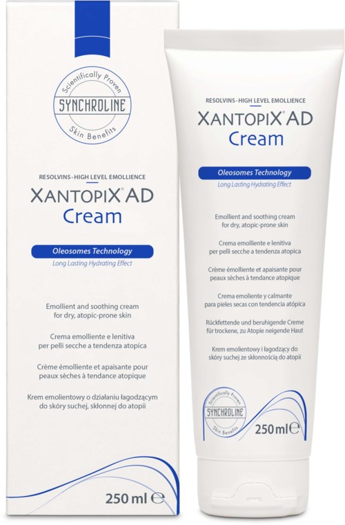 A white tube of Xantopix AD cream with blue text and accents. It is for dry, sensitive skin and contains Oleosomes technology.