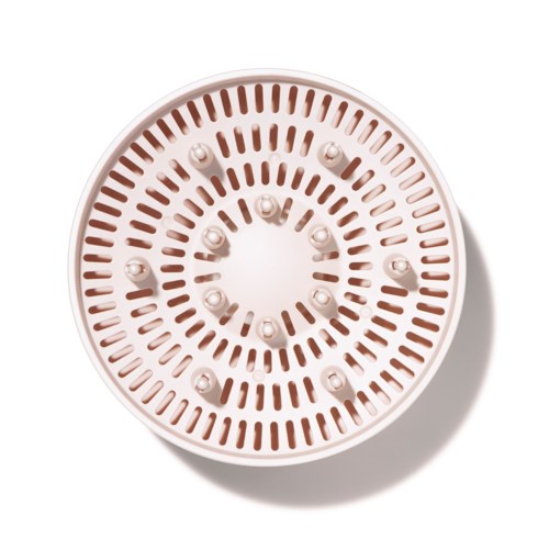 A round smoke detector with multiple small vents and a series of small white sensors or lights inside.