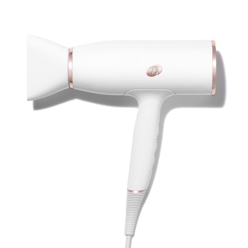 A white hairdryer with pink accents, featuring a handle and a nozzle for blow-drying hair.