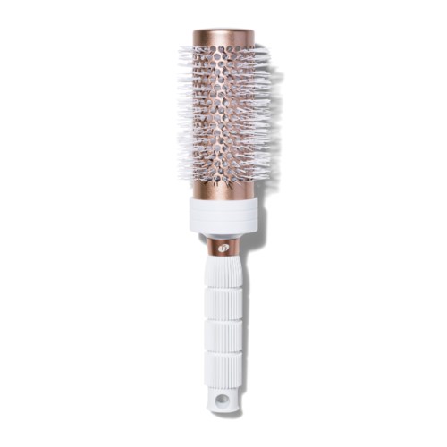 A round hairbrush with a white handle and a rose gold top, bristles are white and dense.