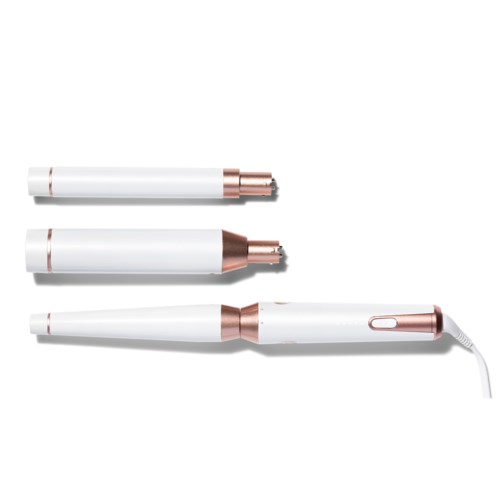 Three white and rose gold styling tools, with one attached to a cord, are laid out on a white surface.