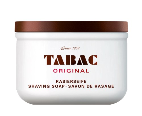 A white jar with a brown lid, labeled as Tabac Original shaving soap, made since 1959.