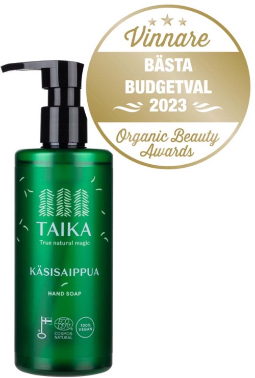 Een groene handzeepfles met pomp, getiteld 'TAIKA', met boomgrafieken en certificeringspictogrammen. Het heeft een gouden erkenningsbadge.