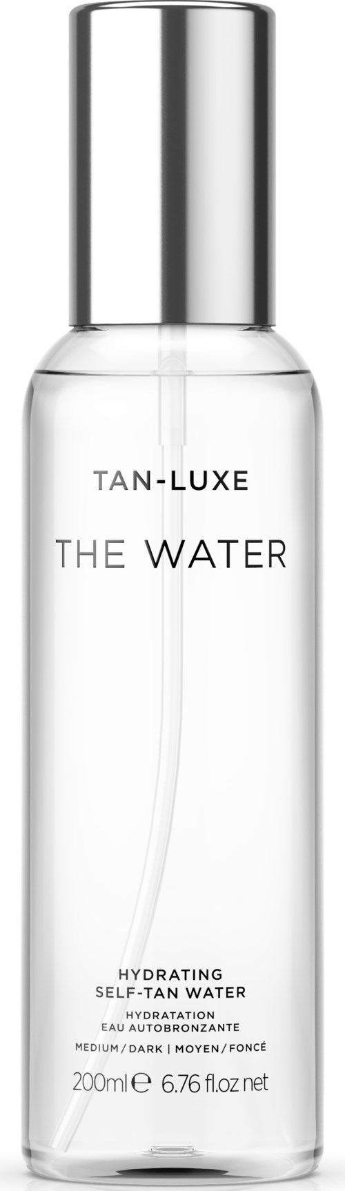 A clear, tall bottle with a silver cap labeled 'TAN-LUXE THE WATER' for hydrating skin.