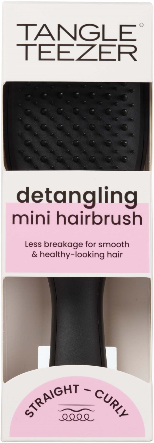 A black hairbrush with a textured surface in a box, labeled for straight or curly hair styling, promoting smooth hair.