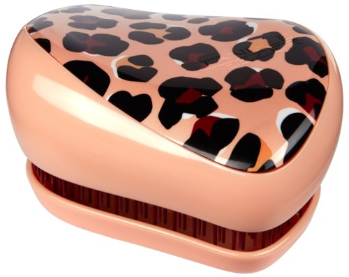 Hjärtformad dosa i persikfärg med leopardmönster på locket.