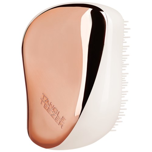 A small, rounded device with a combination of pink, black, and white colors, featuring branding and measurement markings.