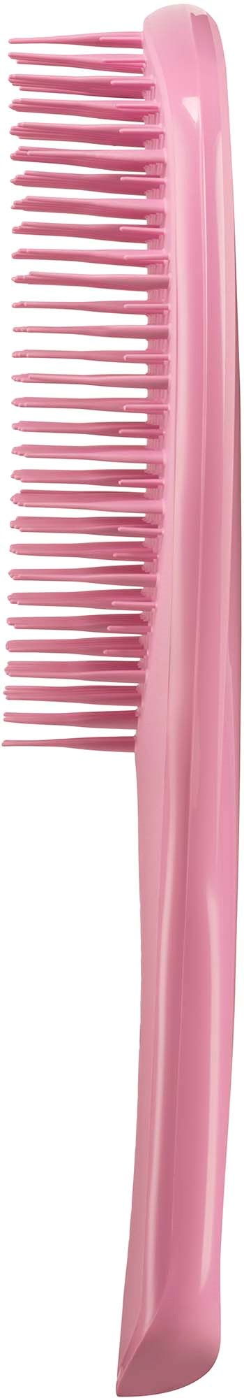 Pink hårkam med brede tenner for å gre håret.