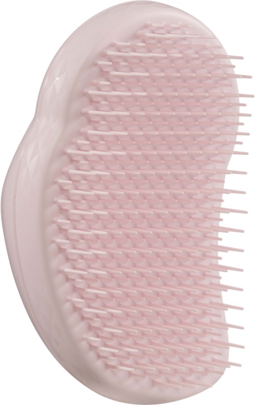 A soft pink facial brush with many short, flexible bristles for cleaning skin.