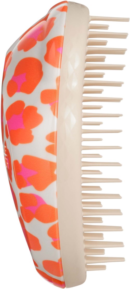 A hairbrush with a colorful, leopard print pattern on the handle and white bristles.