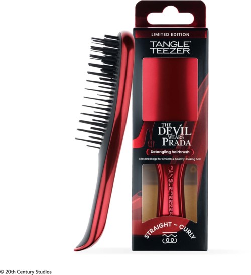 A red and black detangling hairbrush in packaging, with the branding Tangle Teezer and a special Devil Wears Prada edition.