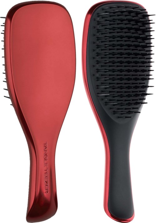 A pair of red and black hairbrushes, one with a smooth surface and the other with bristles.