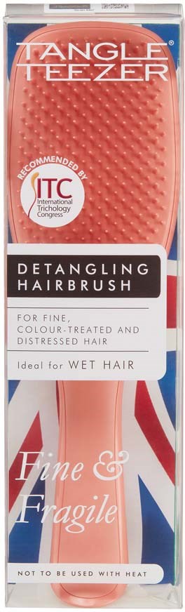 A pink hairbrush with a textured surface, labeled for detangling fine, wet, and fragile hair.