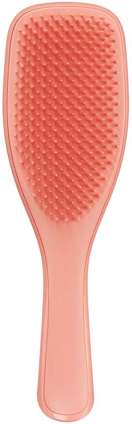 A pink hairbrush with a wide, flat head and many small bristles.