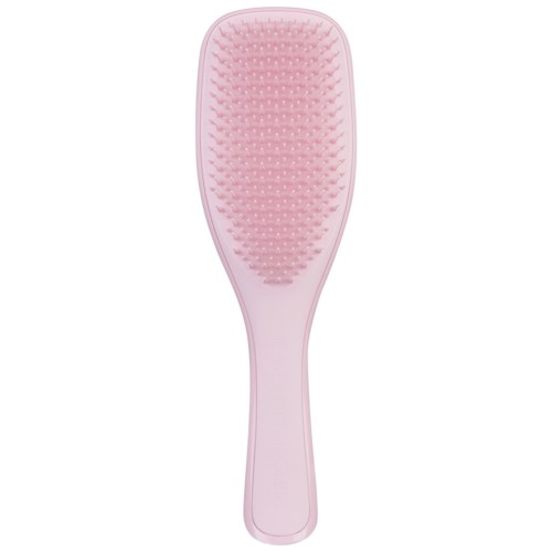 A pink hairbrush with a cushioned, detailed surface and a rounded handle.