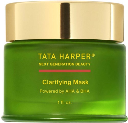 Vihreä purkki kultalaatalla, merkitty Tata Harper Clarifying Mask. Sisältää AHA:ta ja BHA:ta ihonhoitoon.