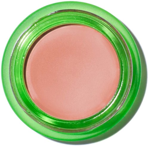 A round container with pink cream and a green lid, viewed from above.