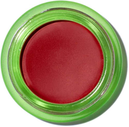 A red paintpot with a green lid seen from above.